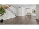 Open concept living room with sleek flooring and staircase, perfect for modern living at 2455 E Broadway Rd # 122, Mesa, AZ 85204