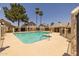 Community pool area with a jacuzzi, seating and beautiful desert landscaping at 2455 E Broadway Rd # 122, Mesa, AZ 85204