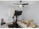 This carpeted room features a ceiling fan, stationary bike, and indoor play structure at 25210 N 40Th Ave, Phoenix, AZ 85083