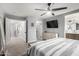 Spacious bedroom boasts neutral colors, carpeted floors, and an ensuite bathroom and walk-in closet at 25210 N 40Th Ave, Phoenix, AZ 85083