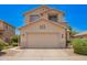 Inviting two-story home featuring a neutral color palette, a tile roof, and a two-car garage at 25210 N 40Th Ave, Phoenix, AZ 85083
