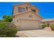 Suburban home with a wide driveway and desert landscaping at 25210 N 40Th Ave, Phoenix, AZ 85083