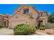 Inviting two-story home with a neutral-toned exterior, desert landscaping, and a welcoming front entrance at 25210 N 40Th Ave, Phoenix, AZ 85083
