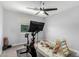 Bright home gym featuring a stationary bike, climbing structure, a ceiling fan, and neutral walls at 25210 N 40Th Ave, Phoenix, AZ 85083