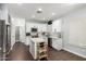 Well-lit kitchen showcasing white cabinets, stainless steel appliances, and an island with marble countertop at 25210 N 40Th Ave, Phoenix, AZ 85083