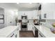 Well-lit kitchen showcasing white cabinets, stainless steel appliances, and an island with marble countertop at 25210 N 40Th Ave, Phoenix, AZ 85083