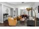 Open-concept living area featuring modern furniture, wood floors, and a view to the dining space at 25210 N 40Th Ave, Phoenix, AZ 85083