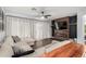 Inviting living room with stylish decor, a cozy sectional, and a modern fireplace at 25210 N 40Th Ave, Phoenix, AZ 85083