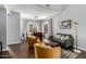 Bright living and dining area with modern lighting, wood floors, and neutral tones at 25210 N 40Th Ave, Phoenix, AZ 85083