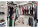 Well-organized walk-in closet features hanging rods, shelves, and ample space for storage and accessories at 25210 N 40Th Ave, Phoenix, AZ 85083