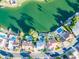 An aerial view showcasing lakefront homes, private docks, and a tranquil neighborhood setting at 2552 S Playa --, Mesa, AZ 85202