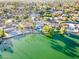 Aerial view of a lakeside community with green space, beautiful homes, and waterfront access at 2552 S Playa --, Mesa, AZ 85202