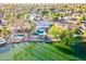 Stunning aerial view of a waterfront home featuring a private pool, lush landscaping, and dock access at 2552 S Playa --, Mesa, AZ 85202