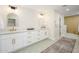 Elegant bathroom with double sink vanity, designer tile, and gold hardware at 2552 S Playa --, Mesa, AZ 85202
