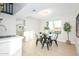 Dining area featuring a marble table, black chairs, and a view of the yard at 2552 S Playa --, Mesa, AZ 85202