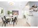 Dining room with a marble table, black chairs, and modern lighting near the kitchen at 2552 S Playa --, Mesa, AZ 85202