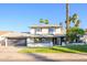 Charming two-story home with well-manicured lawn, brick accents, and a two-car garage at 2552 S Playa --, Mesa, AZ 85202