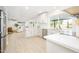 Well-lit kitchen with an open-concept layout, stainless steel appliances, and views of the living area at 2552 S Playa --, Mesa, AZ 85202