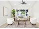 Bright living room featuring neutral colors, modern furniture, and a large window at 2552 S Playa --, Mesa, AZ 85202