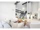 Bright living room with high ceilings, modern furniture, fireplace, and staircase at 2552 S Playa --, Mesa, AZ 85202