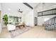 Spacious living room with high ceilings, modern furniture, and view of staircase at 2552 S Playa --, Mesa, AZ 85202
