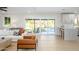 Inviting living room with an open floor plan, white couches, natural light, and easy access to the kitchen at 2552 S Playa --, Mesa, AZ 85202