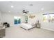 Spacious main bedroom boasts plush carpet, ceiling fan, balcony access, and ample natural light at 2552 S Playa --, Mesa, AZ 85202