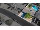 Overhead view of the home's landscaping and curb appeal, with a mature tree and low-maintenance yard at 2608 W Aster Dr, Phoenix, AZ 85029