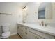 Well-lit bathroom with double vanity, modern fixtures, and ample counter space at 2608 W Aster Dr, Phoenix, AZ 85029