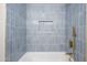 Nicely tiled bath and shower combination with rainfall shower head and soap nook at 2608 W Aster Dr, Phoenix, AZ 85029