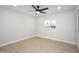 This bedroom features wood-look floors and a bright window at 2608 W Aster Dr, Phoenix, AZ 85029