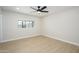 This light bedroom offers sleek floors and a ceiling fan at 2608 W Aster Dr, Phoenix, AZ 85029