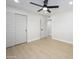 Bedroom featuring wood-look flooring and a roomy closet at 2608 W Aster Dr, Phoenix, AZ 85029