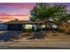 Charming single-story home with a well-kept front yard, complemented by mature landscaping and a welcoming entrance at 2608 W Aster Dr, Phoenix, AZ 85029