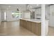 Open concept kitchen with island and stainless steel appliances at 2608 W Aster Dr, Phoenix, AZ 85029