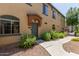 Inviting front entrance of a home with a covered doorway and mature landscaping at 2727 N Price Rd # 32, Chandler, AZ 85224