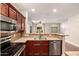 Open concept kitchen with granite countertops and stainless steel appliances at 2727 N Price Rd # 32, Chandler, AZ 85224
