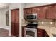 Charming kitchen with stainless steel appliances, granite countertops, and ample cabinet space at 2727 N Price Rd # 32, Chandler, AZ 85224