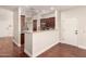 Bright kitchen featuring wood floors, granite countertops, and cherry cabinets in a naturally lit space at 2727 N Price Rd # 32, Chandler, AZ 85224