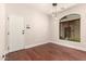 An empty living space boasts stylish wood floors, natural light, and modern fixtures at 2727 N Price Rd # 32, Chandler, AZ 85224