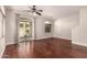 Spacious living room featuring wood floors, large windows, and neutral walls at 2727 N Price Rd # 32, Chandler, AZ 85224