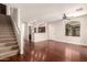 Inviting living room with wood floors, stairs, ceiling fan, and an open layout at 2727 N Price Rd # 32, Chandler, AZ 85224