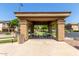 Community picnic area with sheltered tables and seating on a concrete pad at 2727 N Price Rd # 32, Chandler, AZ 85224