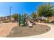 Neighborhood playground with slide, climbing structures, and soft landing surfaces at 2727 N Price Rd # 32, Chandler, AZ 85224
