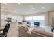 Spacious living room with large windows, tile floors, and comfortable seating at 281 E Shamrock Dr, Chandler, AZ 85286