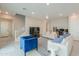 Bright living room with tile flooring, modern furniture, and a staircase to the second floor at 281 E Shamrock Dr, Chandler, AZ 85286