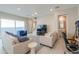 Open living room with natural light, neutral decor, and tile floors at 281 E Shamrock Dr, Chandler, AZ 85286