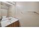 Well-lit bathroom featuring a single sink vanity, a mirror, and a toilet at 2986 N Oregon St # 7, Chandler, AZ 85225