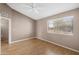 Bright bedroom with laminate flooring and ceiling fan at 2986 N Oregon St # 7, Chandler, AZ 85225