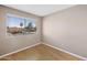 Bright bedroom with hardwood floors and a window providing natural light and neighborhood views at 2986 N Oregon St # 7, Chandler, AZ 85225